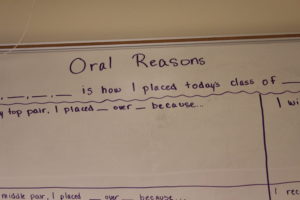 Whiteboard showing oral reasons assignment